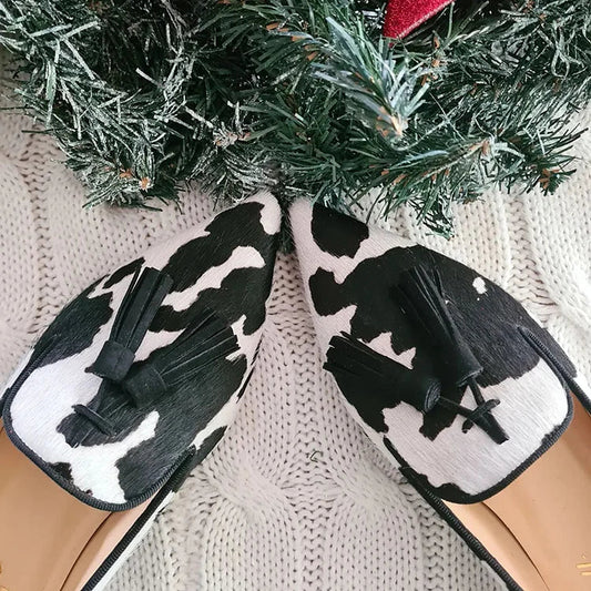 Gwendolyn | Mocassins à imprimé vache avec pompon